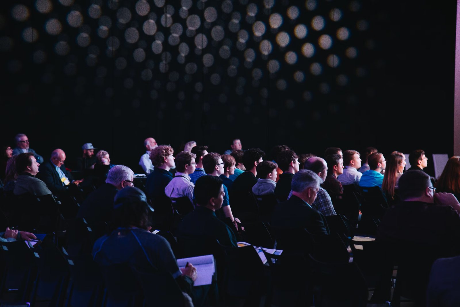 An audience listening at a conference