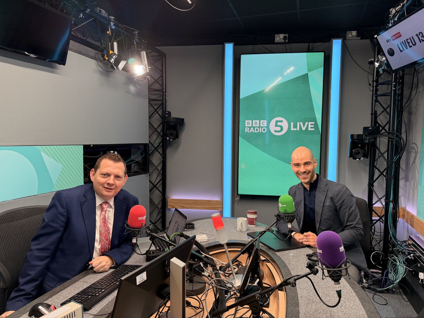 Leon Emirali in the BBC Radio 5 Live studio with the presenter